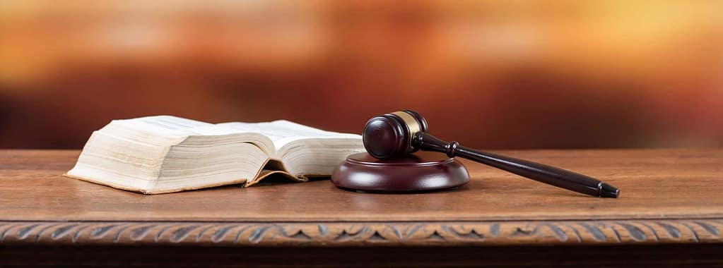 a gavel and a book on a table